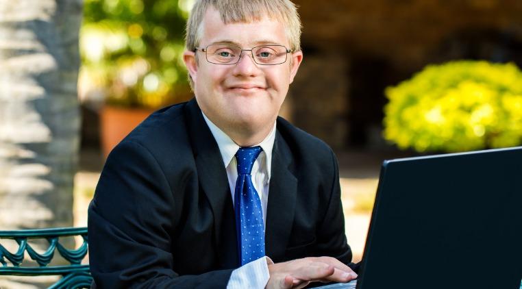 young man with down syndrome at work